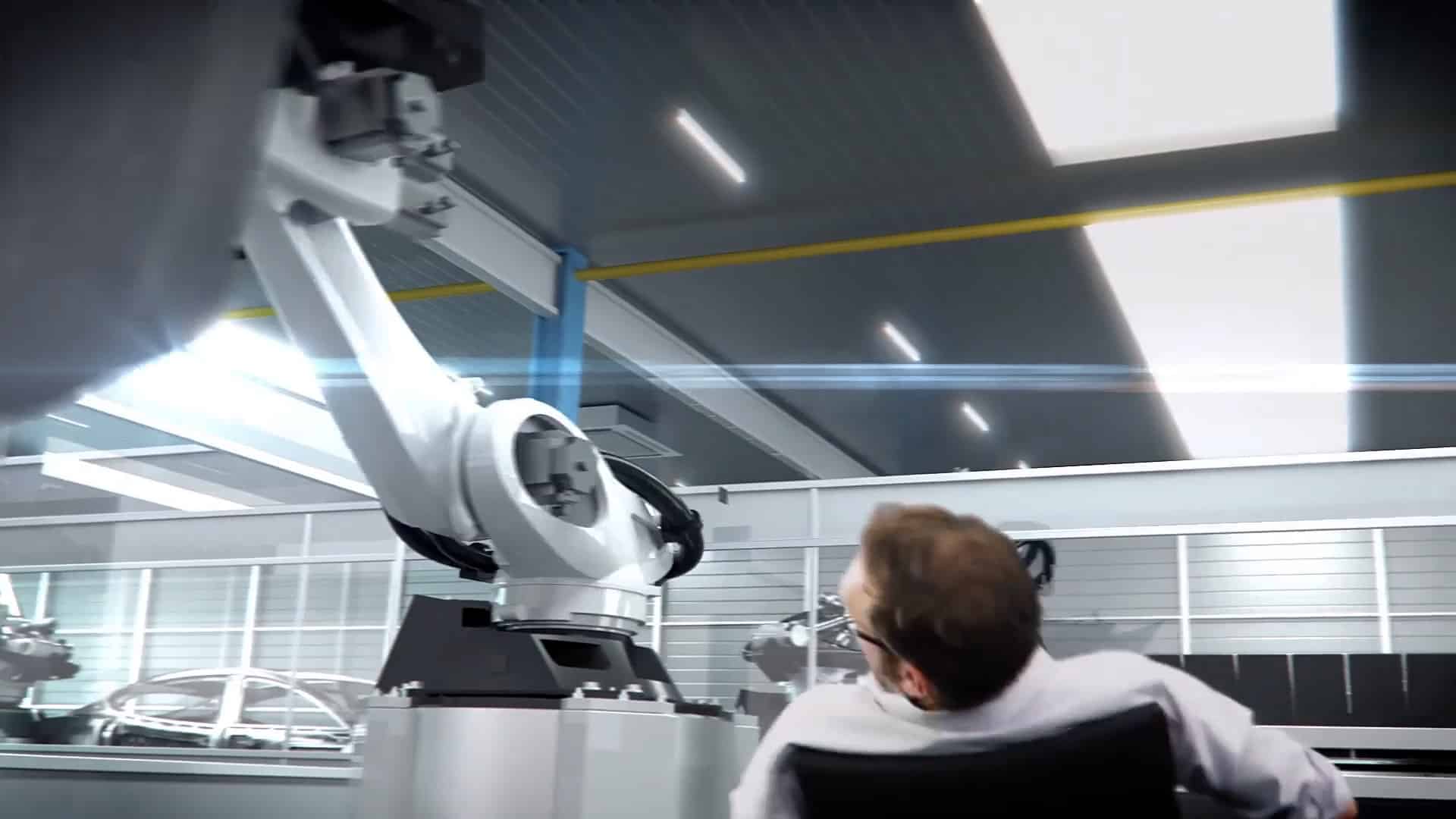 Darsteller lehnt sich zurück während ein Mechanischer Arm der DXQ Digital Intelligence über ihm schwingt.